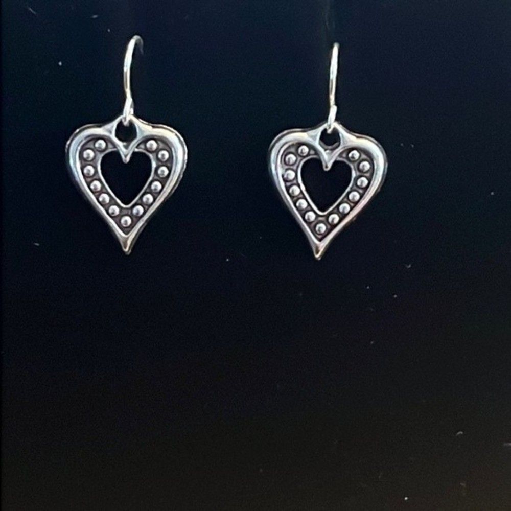 Handcrafted silver tone heart earrings.